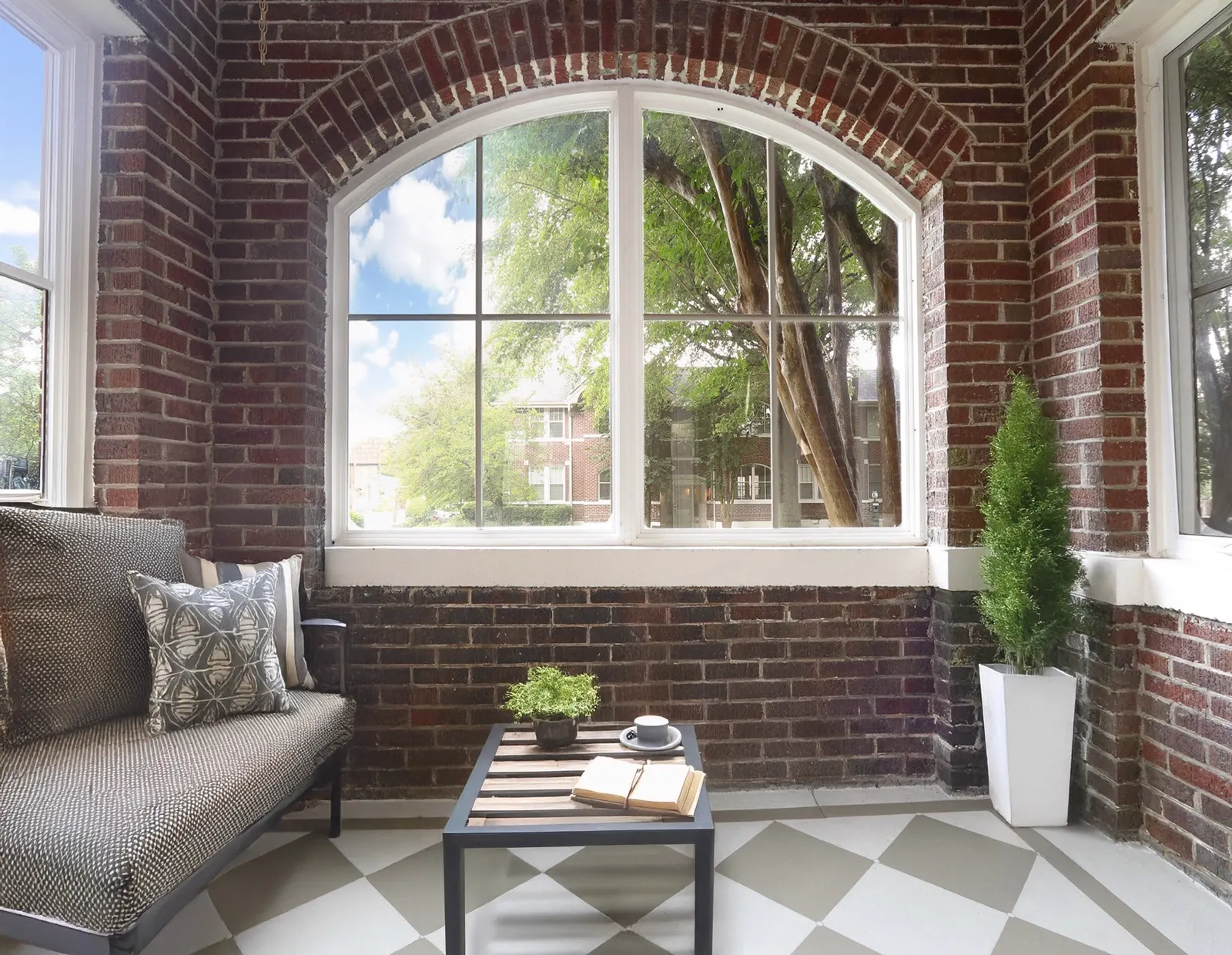 Sunlit courtyard seating at a Midtown Memphis property