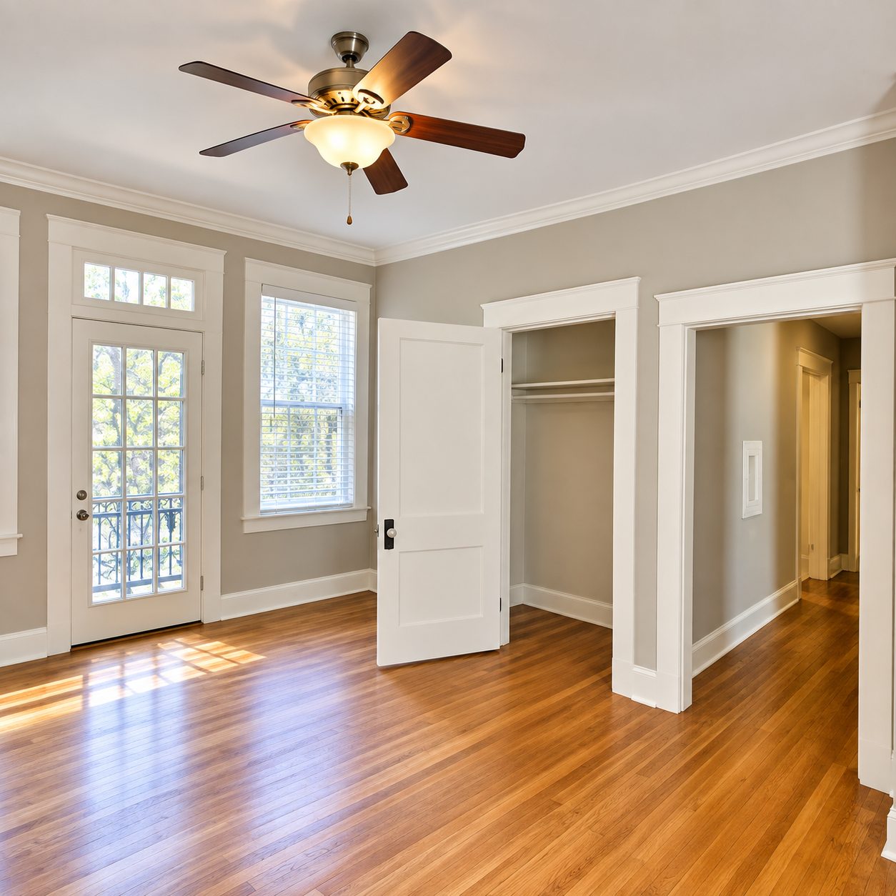 Bedroom with ceiling fan and closet